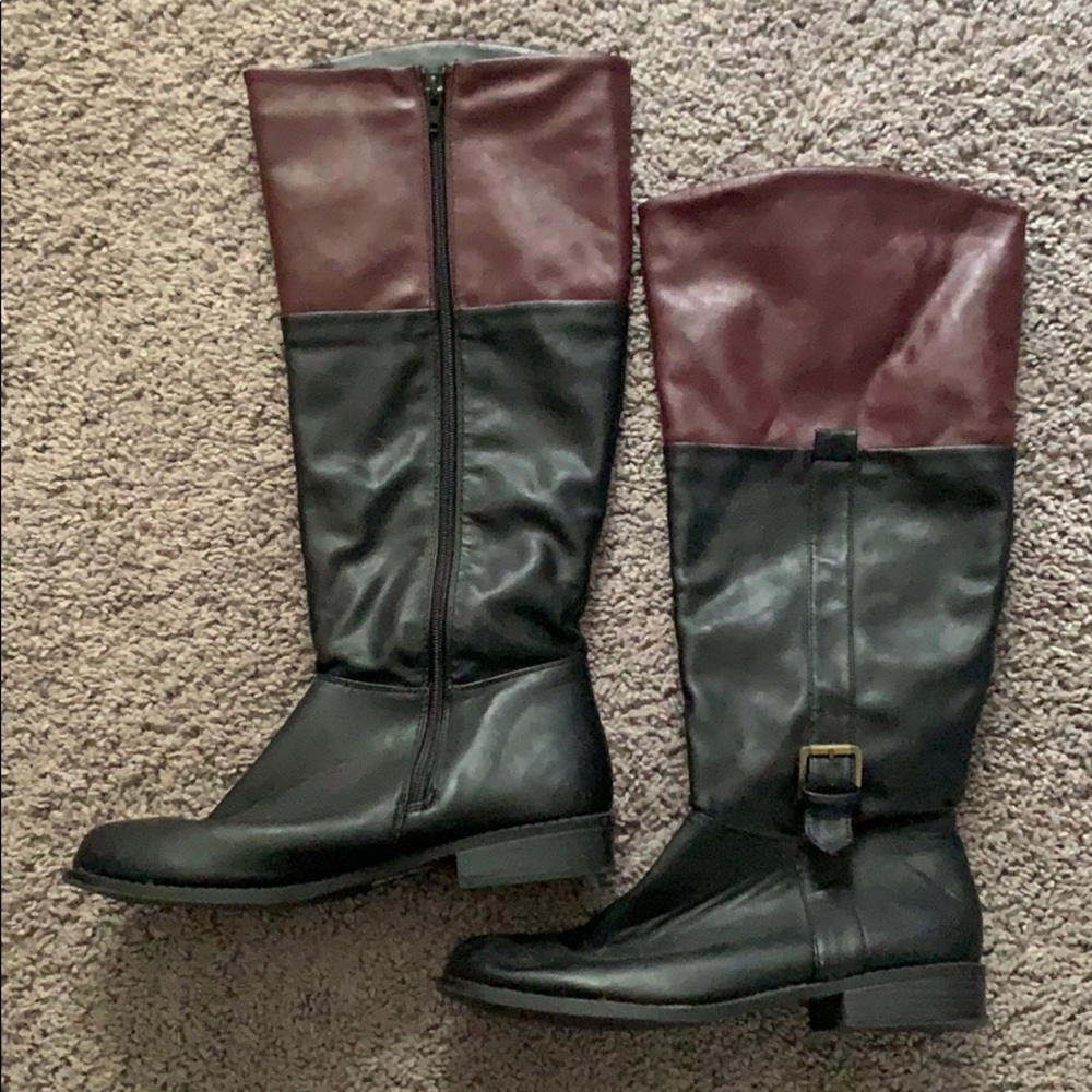 Black boots with burgundy trim at the top